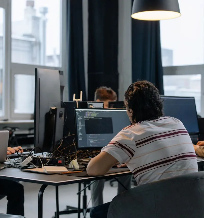 Senior team collaborating on custom software in a client repository