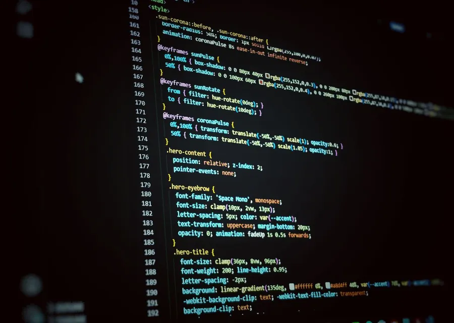 Code on screen behind shipped software services